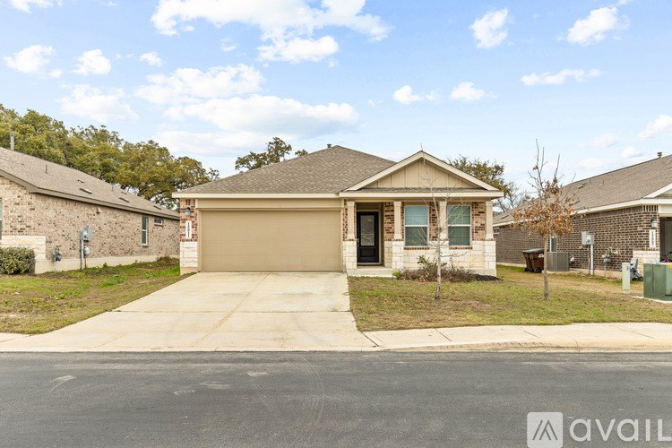 A house with a garage is available for sale.
