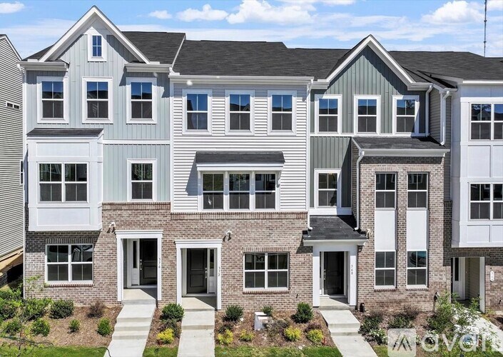 A row of houses with white and grey siding.