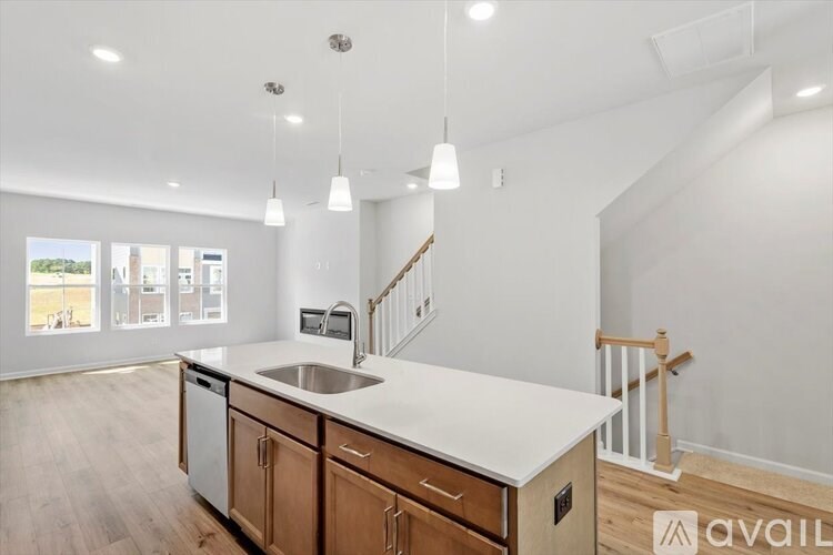 A kitchen with wooden cabinets and a white countertop.
