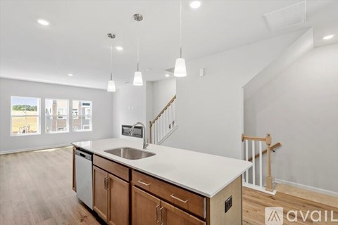 A kitchen with wooden cabinets and a white countertop.