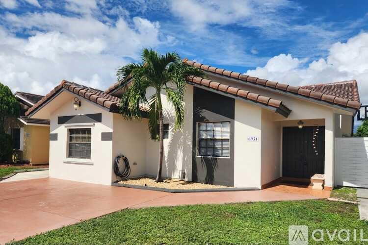 A house with a palm tree in front and a sign that says "available".