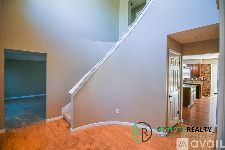 A room with a staircase leading to the upper floor.