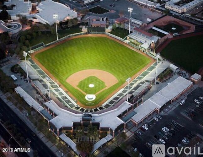 An aerial view of a baseball field surrounded by buildings.