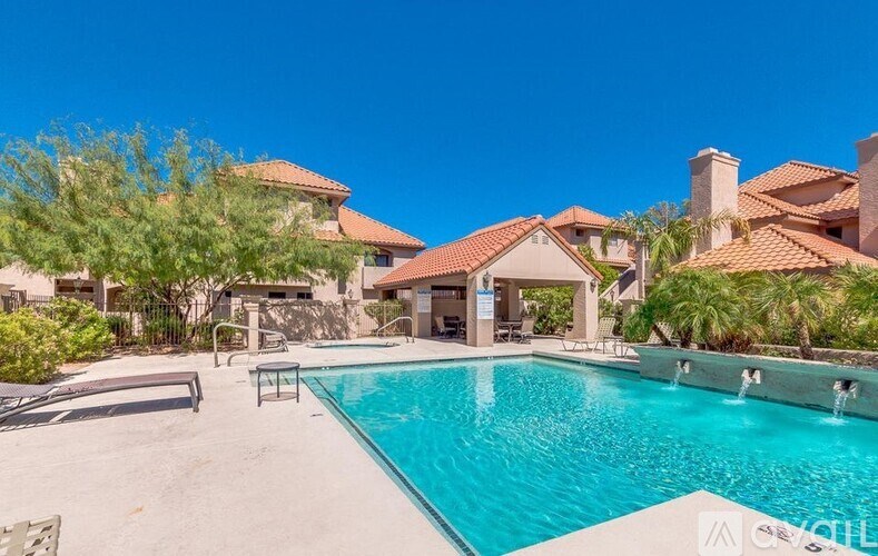 A swimming pool in a backyard with a house in the background.