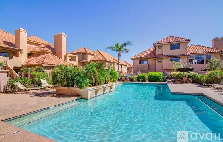 A large swimming pool in front of a house with a sign that says "available".
