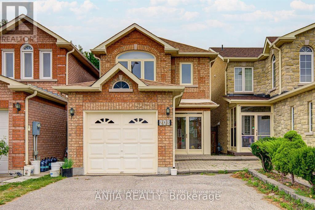 A large, two-story house with a garage and a driveway.