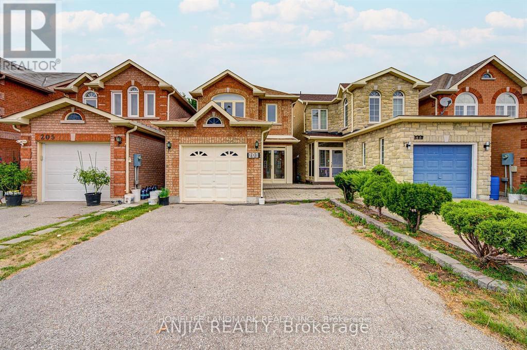 A large, multi-level house with a driveway in front.
