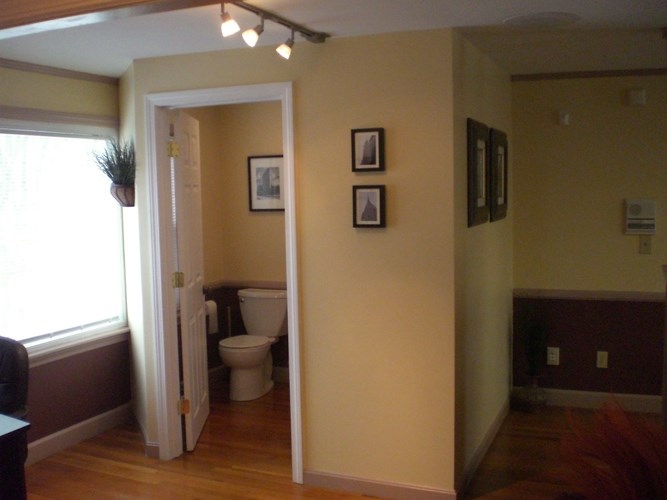 A bathroom with a toilet and a sink.