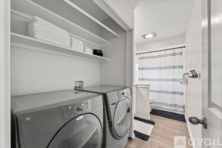 A laundry room with a washer and dryer.