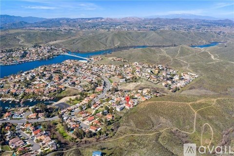 A bird's eye view of a residential area with a river running through it.