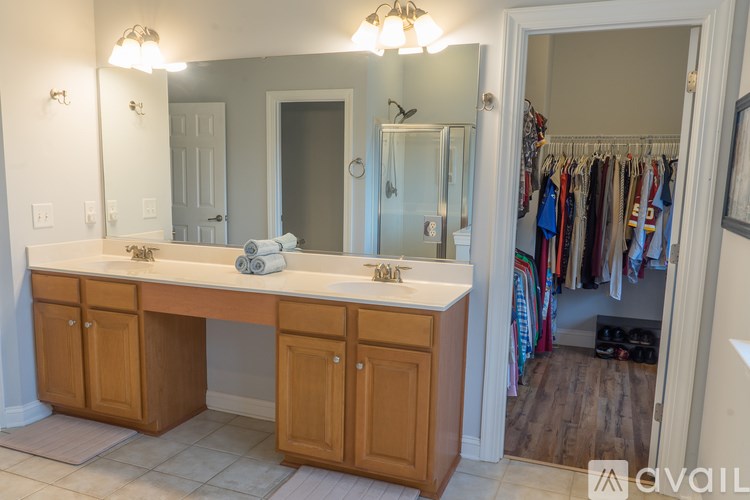 A bathroom with a vanity and a mirror.