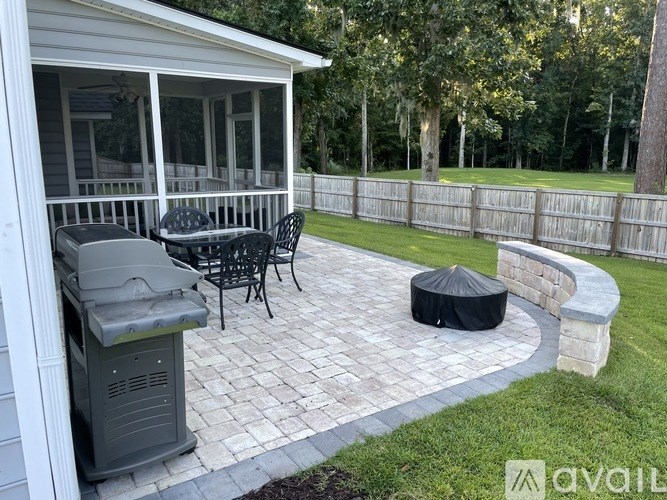 A patio with a table and chairs is shown.