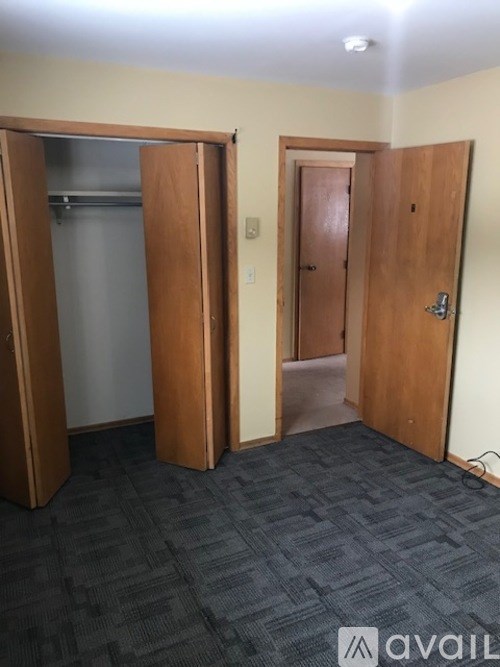 A room with two open wooden doors.