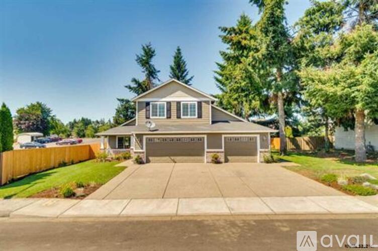 A house with a garage is for sale.