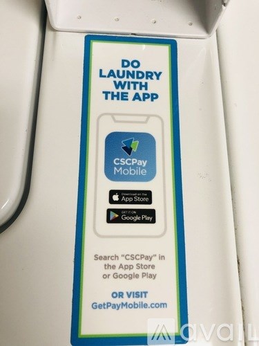 A sign on a machine instructs to download an app to use it.
