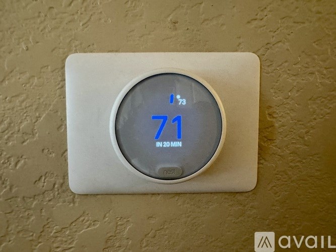A digital thermostat shows a temperature of 71 degrees.
