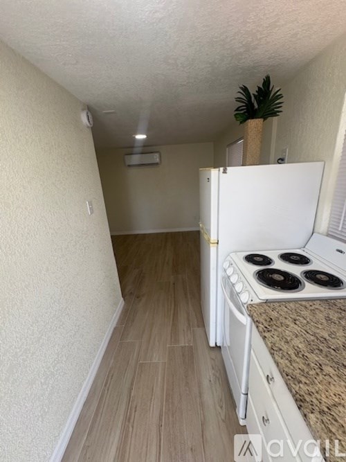 A bathroom with a toilet, sink, and mirror.
