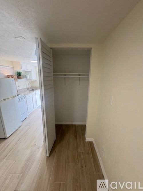 A room with a chair and a box on the floor.