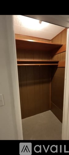 A wooden shelving unit in a room.