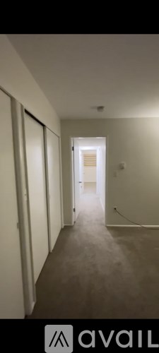 A long hallway with a light at the end.