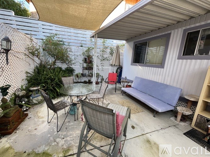 A patio with a table and chairs is shown.