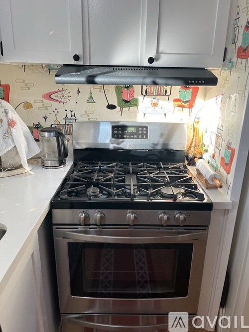 A stove top oven with a pot on it.