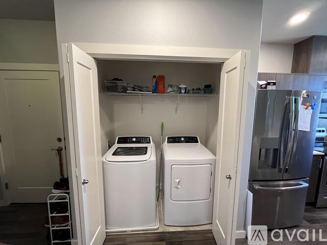 A laundry room with a washer and dryer in it.
