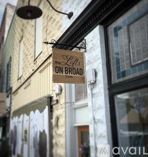 A sign hanging from a building that says "The Leff's on Broad Dunn".