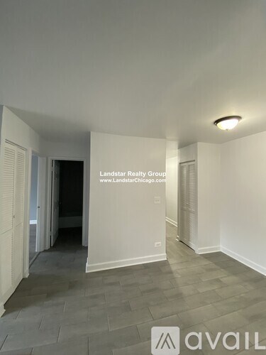 A room with a white wall and a logo that says "avail".