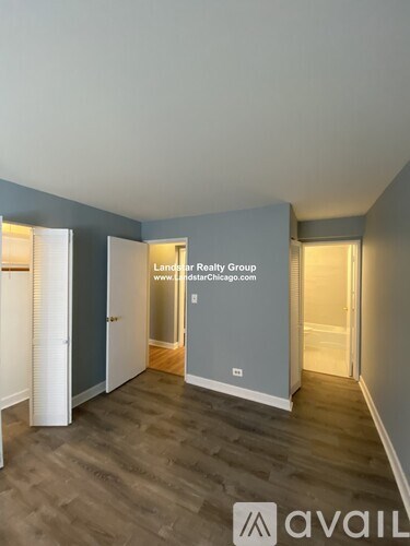 A room with Landsair Realty Group logo and website on the wall.