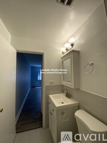 A bathroom with a sink, toilet and bathtub.