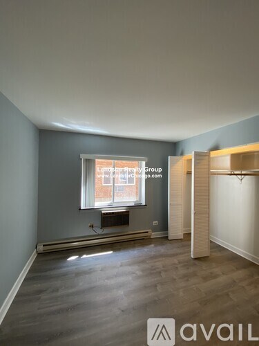 A room with a window and a sign that says "Available".