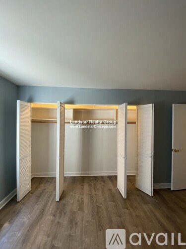 A room with a Landstar Realty Group sign in the middle.