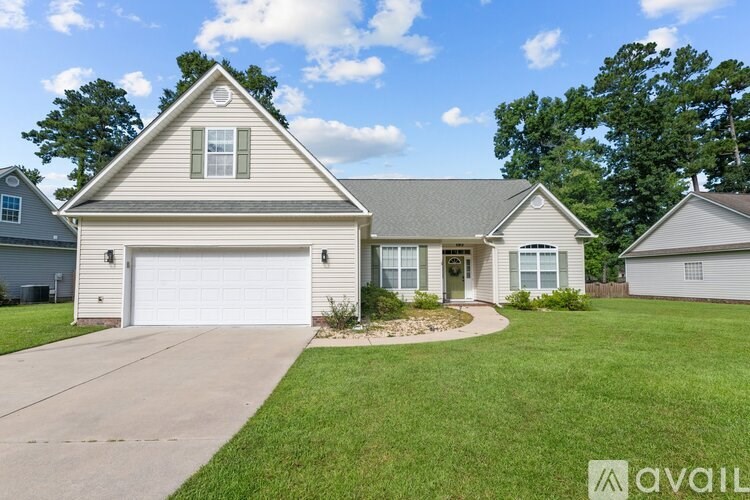 A house with a garage is available for sale.