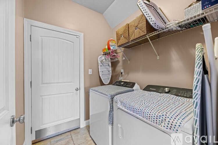 A laundry room with a washer and dryer.