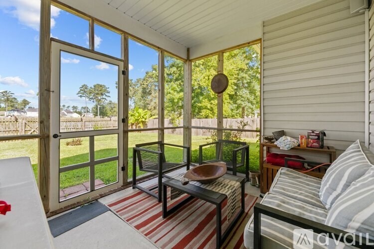 A patio with a table and chairs is shown.