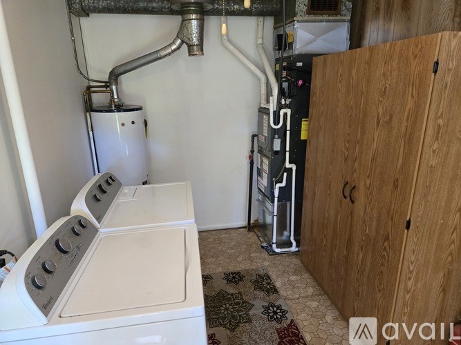 A washer and dryer are installed in a small room.