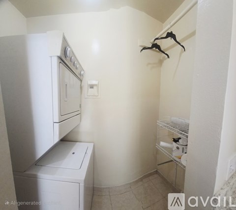 A small laundry room with a washer and dryer.
