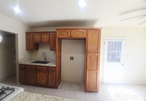 A kitchen with a sink and cabinets.