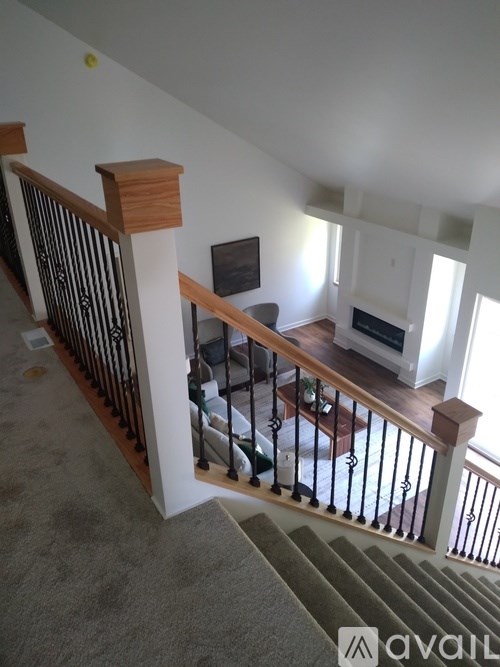 A living room with a couch and a television.