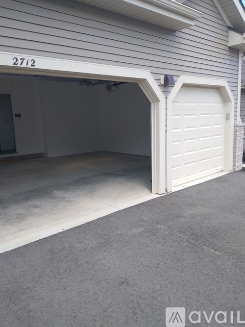 A garage door with the number 2712 on it.