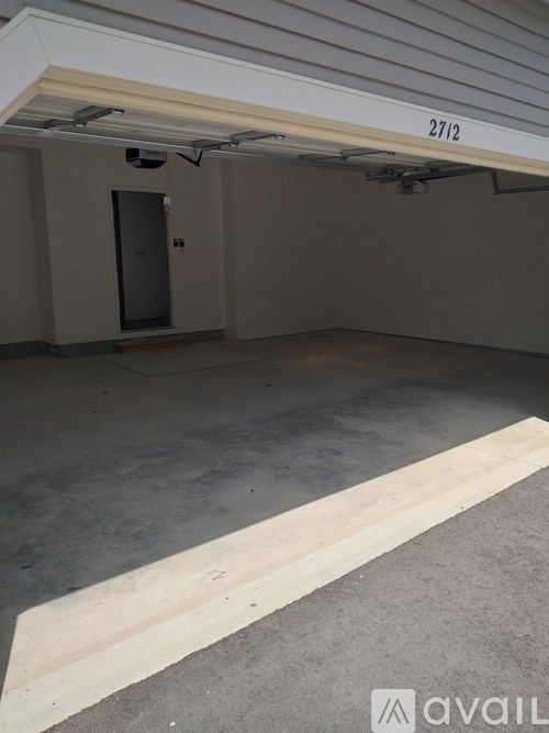 A room with a door and a number 2712 on the wall.