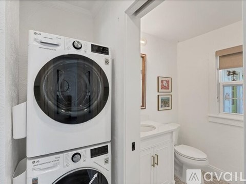 A white LG washing machine and dryer in a small laundry room.