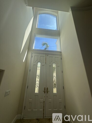 A white door with a glass window above it.