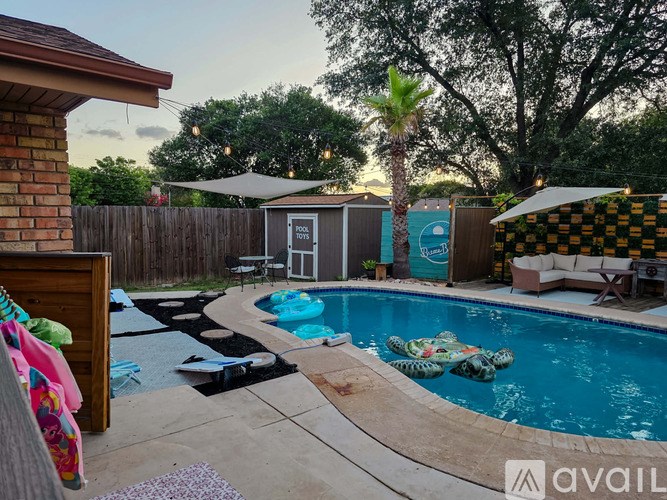 A pool with a turtle float in the middle of it.