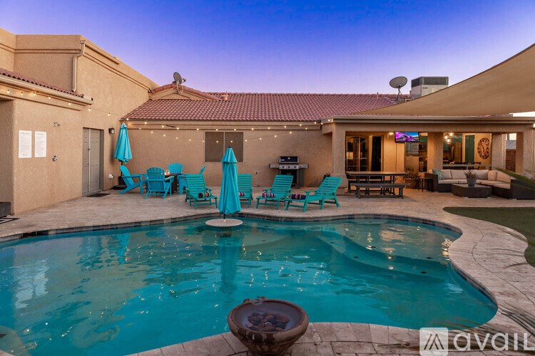 A pool with a fountain in the middle of it.