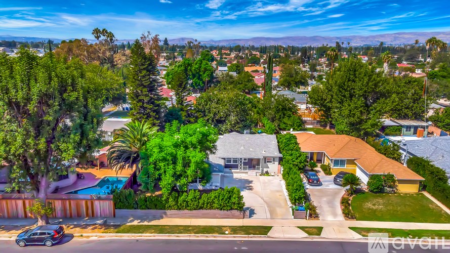 A suburban neighborhood with houses and trees.