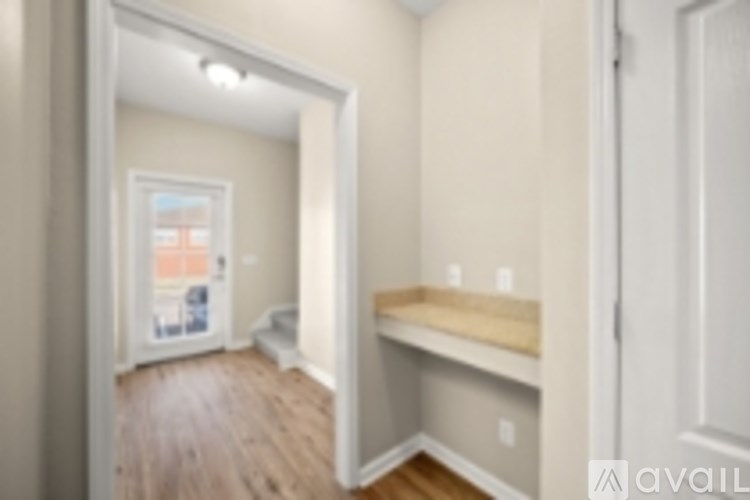 A room with a white door and a window.