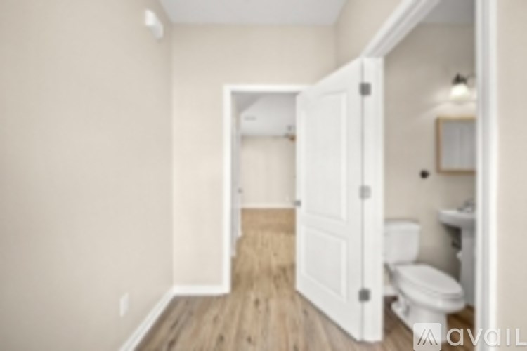 A bathroom with a toilet and sink is shown.