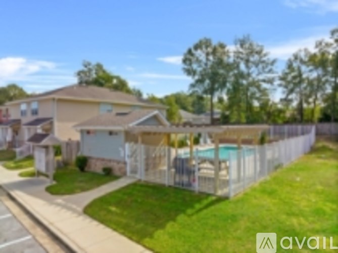 A residential area with houses and a pool.